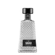 Clear 1800 Cristalino Tequila bottle with silver label and cap, showcasing the premium spirit in a sleek glass bottle.