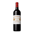 Bottle of Château Cheval Blanc 2014 red wine, a Premier Grand Cru Classe from St. Emilion, displayed on a wooden surface.