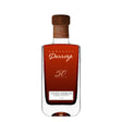 Darroze 50th Anniversary Armagnac in a glass, showcasing its rich color and elegant bottle design from the Darroze spirits collection.