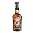 Michters U.S. Number 1 Toasted Barrel Whiskey bottle with label and amber-colored liquid in a glass.