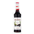 Bottle of Monin Blackcurrant Syrup with blackcurrant flavor, featuring the Monin brand logo on the label.