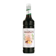 Bottle of Monin Chai Tea Syrup for making flavorful chai beverages, with a clear label and cap visible.