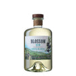 Bottle of Blossom Costa Blanca Gin, a non-agency gin with a clear glass bottle and colorful floral label.