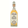 Fortaleza Anejo Tequila bottle on a wooden surface, showcasing the premium non-agency tequila brand with a clear glass bottle.
