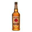 Four Roses Bourbon bottle, non-agency whiskey with distinctive label and amber-colored liquid in a clear glass.