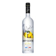 Grey Goose Le Citron vodka bottle in clear glass with yellow lemon label, on a neutral background.