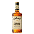 Bottle of Jack Daniel's Honey whiskey with label visible, featuring golden honey color and classic Jack Daniel's branding.