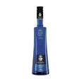 Joseph Cartron Curacao Blue Liqueur bottle with vibrant blue liquid, showcasing the elegant label and glass bottle.