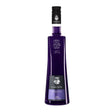 Joseph Cartron Violette Liqueur bottle, clear glass with purple-tinted liquid and elegant label, on a neutral background.