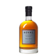 Koval Four Grain Whiskey bottle with label, showcasing clear glass bottle and amber-colored whiskey inside.