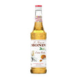 Bottle of Monin Creme Brulee syrup with a label displaying the Monin brand and flavor, used for desserts and coffee toppings.