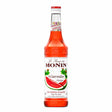 Bottle of Monin Watermelon Syrup showing the label, designed for adding watermelon flavor to beverages and desserts.