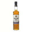 Bottle of Ragtime Rye Bottled in Bond Whiskey by New York Distilling Company, featuring a clear label and amber liquid inside.