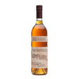 Bottle of Rowan's Creek Bourbon, a non-agency whiskey with a clear label and amber liquid inside, on a wooden surface.